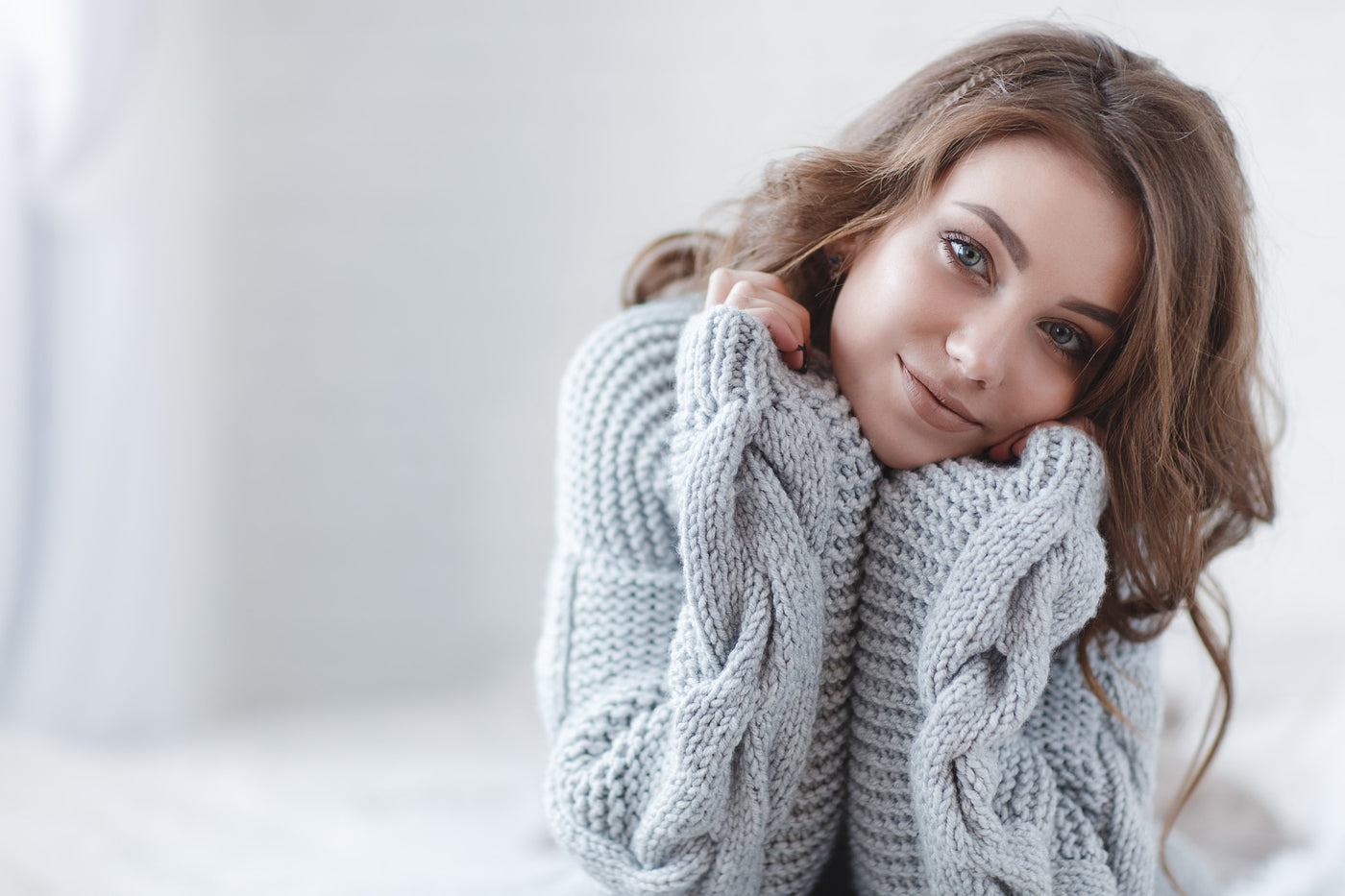 Stylish woman in a fashionable jumper and sunglasses