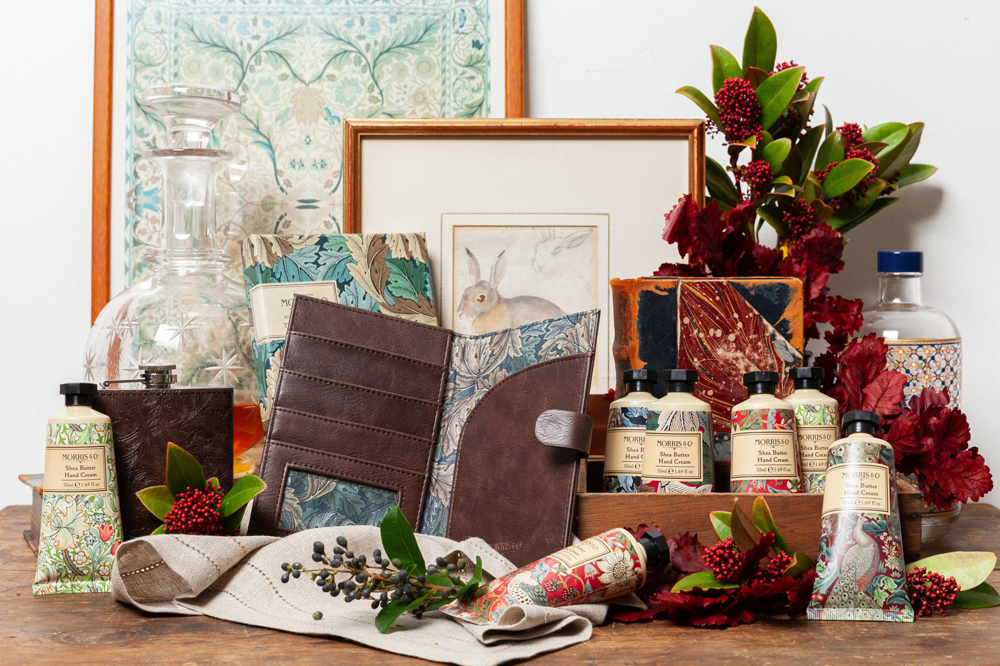 A variety of gifts for men from leather accessories mens grooming positioned on a table with a map in the background