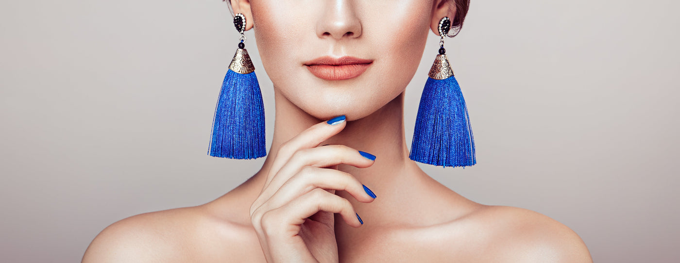 Blue tassel earrings on stylish model
