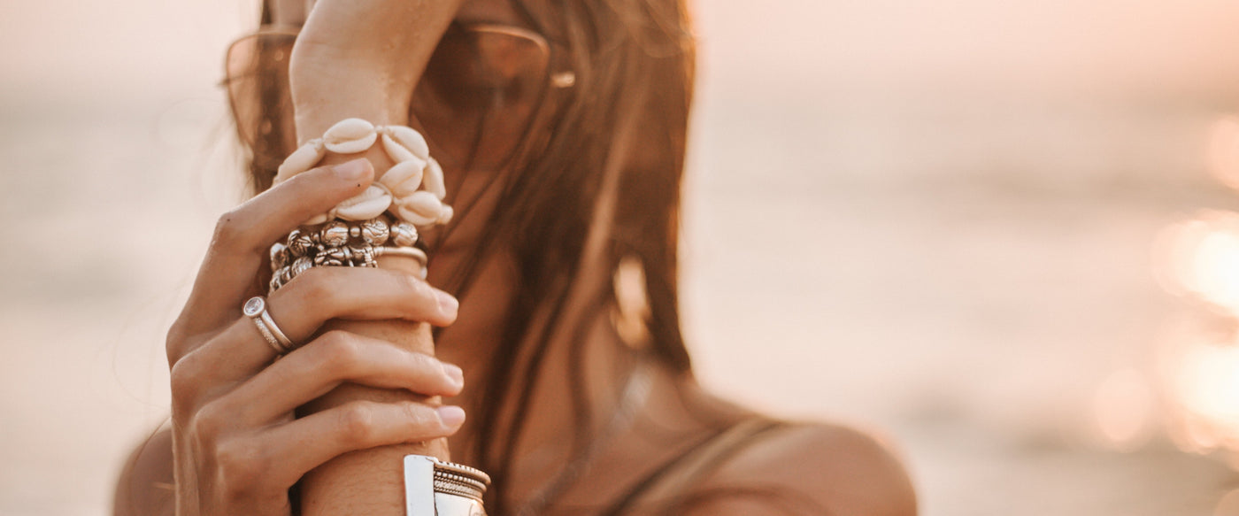Woman wearing boho beach bracelets